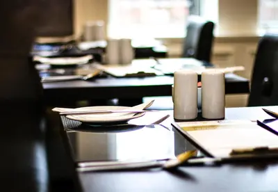 a table with plates and napkins on top of it at Embassy Apartments in Glasgow