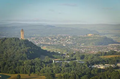 a view of a city with a tower on a hill at Stirling Youth Hostel in Stirling