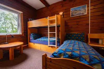 a bedroom with a bunk bed in a cabin at Glencoe Youth Hostel in Ballachulish