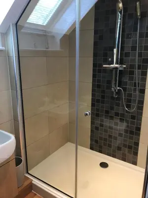 a shower with a glass door in a bathroom at Socair in Callander