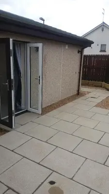 an open door on a building with a patio at Ritchie selfcatering in Callander