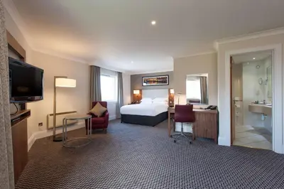 a hotel room with a bed and a bathroom at Doubletree By Hilton Glasgow Strathclyde in Bellshill