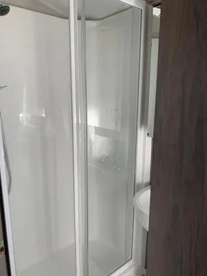 a glass shower in a bathroom with a toilet at Brookwood Sea View 14 in Dunoon