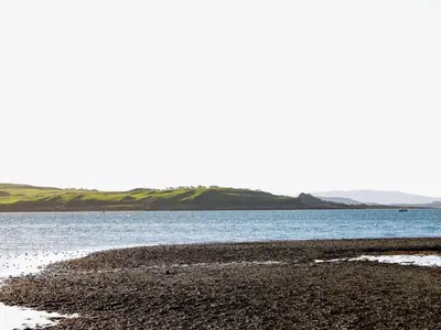 a beach with a body of water and the ocean at MACS Place in Largs