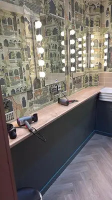 a hair salon counter with two hair dryers on it at Revolver Edinburgh in Edinburgh