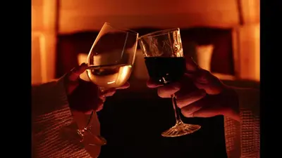 two people holding glasses of wine in their hands at Aos Sí Lodges in Ballachulish
