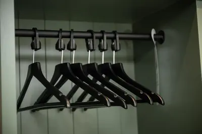 a bunch of black utensils hanging on a rack at Ardencaple Hotel by Greene King Inns in Helensburgh