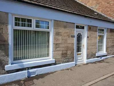 a building with a window and a door at Churchview in Townhill