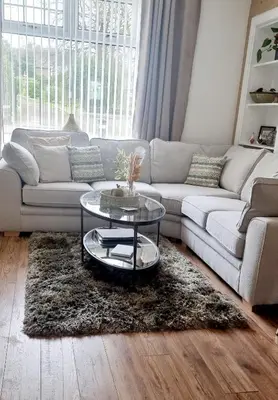 a living room with a couch and a table at Churchview in Townhill