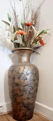 a vase with flowers in it sitting on a table at Churchview in Townhill