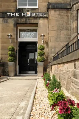 a building with a door with flowers in front of it at The Hostel in Edinburgh