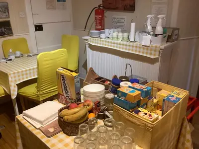 a table with a bunch of food on it at Nethermains House in Kilwinning