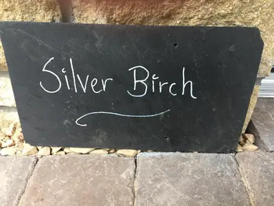 a sign that says silver birch on the sidewalk at Rosemount Boutique B&B in Lanark