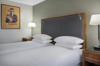 a hotel room with a bed with white pillows at Delta Hotels by Marriott Edinburgh in Edinburgh