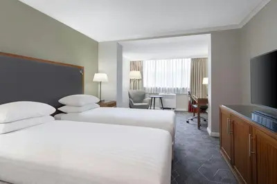 a hotel room with two beds and a flat screen tv at Delta Hotels by Marriott Edinburgh in Edinburgh