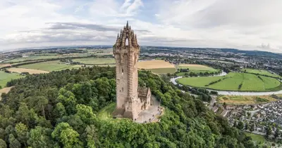 an aerial view of a tower on top of a castle at Kirk View Apartment in Stirling