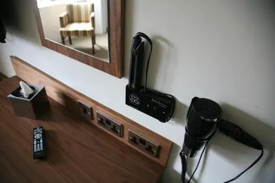 a room with a microphone and a mirror at Acorn Hotel in Glasgow