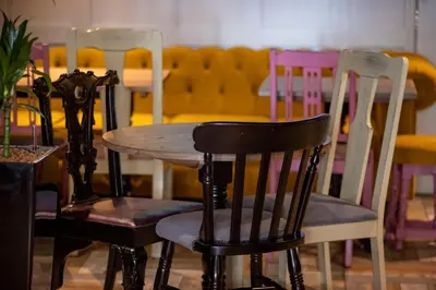 a table with two chairs and a table with at The Waverley Hotel in Callander