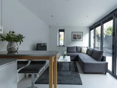 a living room with a couch and a table at Gillespie House in Edinburgh