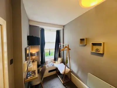 a home office with a desk and a window at Ardenlee Guest House in Edinburgh