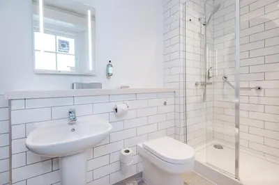 a bathroom with a sink and a toilet and a shower at Toby Carvery Edinburgh West by Innkeeper's Collection in Edinburgh
