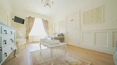 a living room with a table and a couch at The Old Tramhouse Self Catering Apartments in Stirling