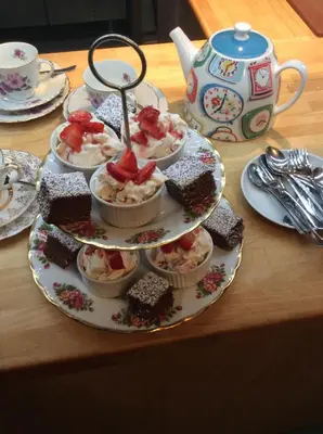 a table with a plate of desserts on a table at Ashbank Hotel in Carradale
