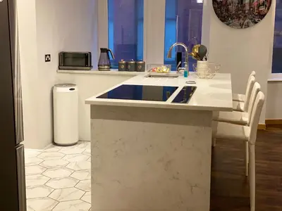 a kitchen with a sink and a counter at 2 bed Chic Apartment in Glasgow City Centre in Glasgow