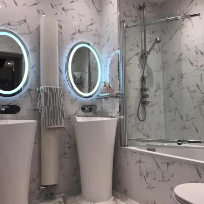 a bathroom with a shower and a toilet and a sink at 2 bed Chic Apartment in Glasgow City Centre in Glasgow