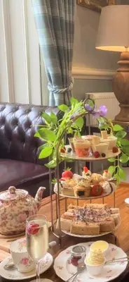 a table with several plates of food on a table at Dungallan Country House in Oban