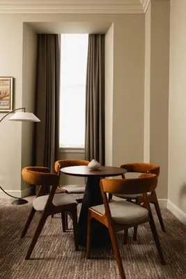 a room with a table and chairs and a window at Native Glasgow in Glasgow