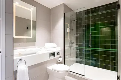 a bathroom with a toilet and a sink and a shower at Native Glasgow in Glasgow