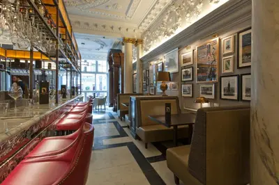 a restaurant with a row of chairs and a bar at Native Glasgow in Glasgow