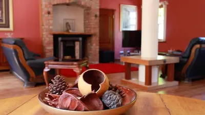 a bowl of fruit on a table in a living room at Coachouse in Balloch