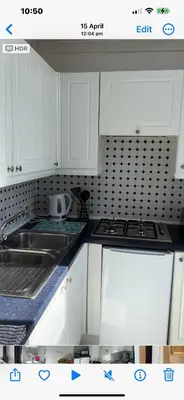a kitchen with white cabinets and a stove top oven at West Highland Way Rooms ED30002F in Milngavie