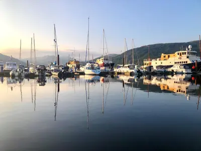 a group of boats are docked in a harbor at Amber Lodge in Hunters Quay