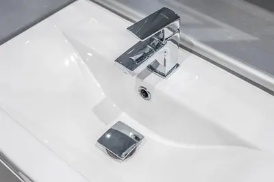 a sink with a faucet on top of a white sink at Prime Commuter Executive Apartment Dunfermline in Dunfermline