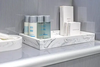 a white shelf with some products on top of it at Prime Commuter Executive Apartment Dunfermline in Dunfermline