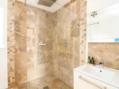 a bathroom with a shower and a sink at Lurach House in Port Appin