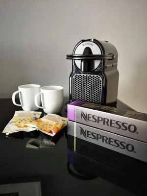 a coffee maker and two cups on a table at Bay and Bridge near Edinburgh in Dunfermline