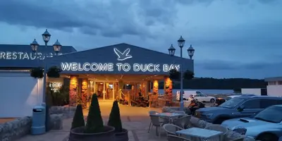 a building with a sign that reads welcome to duck bay at Duck Bay Hotel & Restaurant in Balloch