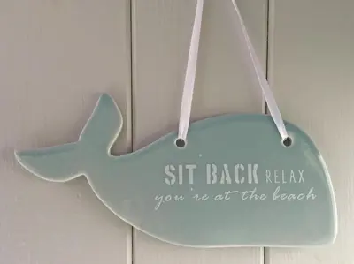 a sign that says sit back relax youre at the beach at Old Fisherman's Cottage in Rothesay