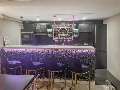 a purple bar with purple stools in a kitchen at The Golden Crown in Tarbolton