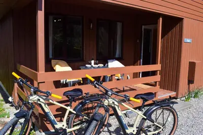 two bikes parked in front of a wooden bench at Birchbrae Highland Lodges in Onich