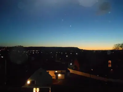 a view of a city at night with the sky at Wallace's Rest in Stirling