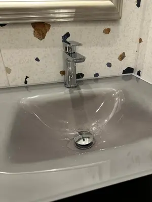 a white sink with a faucet on top of it at Stunning 2 bedroom apartment in Glasgow