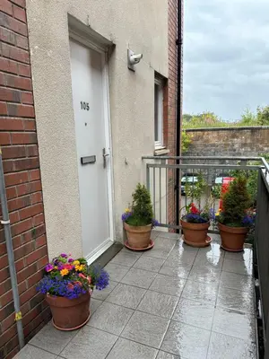 a group of potted plants sitting outside a door at Stunning 2 bedroom apartment in Glasgow