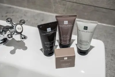 a group of three products sitting on a bathroom sink at Knipoch House Hotel in Oban