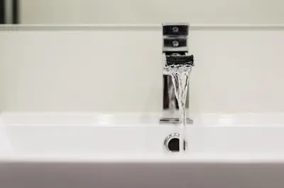 a bathroom sink with a water fountain at City Centre, 5 star Ground Floor in Edinburgh