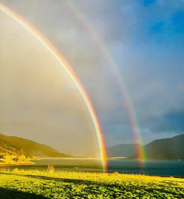 two doublebows over a body of water at Highland Croft B&B in Onich
